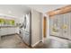 Bright kitchen featuring stainless steel appliances, ample cabinetry, and tile flooring at 116 Cottage Grove Ln, Mooresville, NC 28117