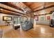 Living room featuring wood floors, exposed beams, a ceiling fan, and neutral-toned walls at 116 Cottage Grove Ln, Mooresville, NC 28117