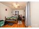 Bedroom featuring a wood frame bed, desk area, and hardwood floors at 129 38Th St, Hickory, NC 28601