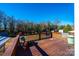 Wooden deck area outside the house with seating area, furniture, and wooded view at 129 38Th St, Hickory, NC 28601