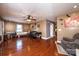 Open living room has wood floors, ceiling fan and neutral walls at 129 38Th St, Hickory, NC 28601