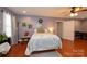 Relaxing main bedroom with calming colors, hardwood flooring, and decorative accents at 129 38Th St, Hickory, NC 28601