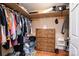 Walk-in closet with wooden floors, built-in shelves and wooden dresser at 129 38Th St, Hickory, NC 28601