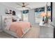 Charming bedroom featuring a comfortable bed, playful decor, two windows, and a modern ceiling fan at 1440 Ardmore Dr # 343, Sherrills Ford, NC 28673