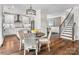 Open dining area with modern lighting, views to the kitchen and staircase at 1440 Ardmore Dr # 343, Sherrills Ford, NC 28673