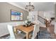 Well-decorated dining room with a wooden table, seating for six, wainscoting, and an adjacent staircase at 1440 Ardmore Dr # 343, Sherrills Ford, NC 28673