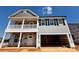 Charming two-story home featuring a welcoming front porch, two-car garage, and classic architectural details at 1440 Ardmore Dr # 343, Sherrills Ford, NC 28673