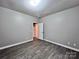 Neutral bedroom featuring modern laminate floors, and ample natural light at 145 Mcbride Dr, Rockwell, NC 28138