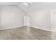 Large primary bedroom with vaulted ceilings and wood look floors throughout at 145 Mcbride Dr, Rockwell, NC 28138