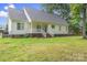 Exterior rear view of a well-maintained house with a lush, green lawn at 145 Mcbride Dr, Rockwell, NC 28138