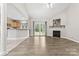 Spacious living area with a fireplace, wood floors, and plenty of natural light at 145 Mcbride Dr, Rockwell, NC 28138