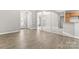 Open living space with wood flooring and neutral paint, leading to the foyer, dining area and kitchen at 145 Mcbride Dr, Rockwell, NC 28138