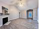 Spacious living room with fireplace and large front window showcases the home's inviting atmosphere at 145 Mcbride Dr, Rockwell, NC 28138