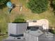 A bird's-eye view of the backyard featuring a patio, playground, mature trees, and a well-maintained lawn at 1800 Robbins Meadows Dr, Waxhaw, NC 28173