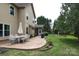The expansive backyard features a patio with seating, a grill, and a play area at 1800 Robbins Meadows Dr, Waxhaw, NC 28173