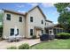 Beautiful backyard with outdoor dining set, grill, and screened-in porch with many windows at 1800 Robbins Meadows Dr, Waxhaw, NC 28173