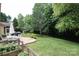 A backyard features a patio with outdoor seating, a garden, and a playground at 1800 Robbins Meadows Dr, Waxhaw, NC 28173