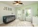 Light green Bedroom with white trim and a black crib at 1800 Robbins Meadows Dr, Waxhaw, NC 28173