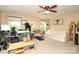 Spacious bedroom featuring a ceiling fan, a sofa, and a large window that provides ample natural light at 1800 Robbins Meadows Dr, Waxhaw, NC 28173
