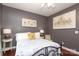 Bedroom with an elegant painting above the bed and neutral colored walls at 1800 Robbins Meadows Dr, Waxhaw, NC 28173