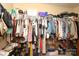A spacious walk-in closet with lots of shelving and hanging space at 1800 Robbins Meadows Dr, Waxhaw, NC 28173