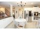 Eat-in kitchen featuring white cabinetry, stainless steel appliances, and granite countertops at 1800 Robbins Meadows Dr, Waxhaw, NC 28173