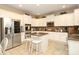 Bright kitchen with white cabinets, stainless steel appliances, and a center island with seating at 1800 Robbins Meadows Dr, Waxhaw, NC 28173