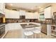 Charming kitchen featuring white cabinets, granite countertops, and stainless steel appliances at 1800 Robbins Meadows Dr, Waxhaw, NC 28173