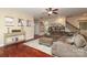 Spacious living room with hardwood floors, a cozy sectional, and stylish decor for Gathering gatherings at 1800 Robbins Meadows Dr, Waxhaw, NC 28173