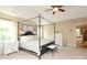 Bedroom features a decorative sign above the bed, tray ceiling, and large windows at 1800 Robbins Meadows Dr, Waxhaw, NC 28173