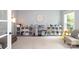 Bright playroom with plenty of storage, shelving, a mini kitchen, and a cozy seating area at 1800 Robbins Meadows Dr, Waxhaw, NC 28173