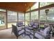 A screened porch with wicker seating, a rug, and a ceiling with wood planks at 1800 Robbins Meadows Dr, Waxhaw, NC 28173