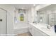 Bathroom featuring double vanity, soaking tub under a window, neutral colored tile, and shower at 200 Parker Claire Ln, Kings Mountain, NC 28086