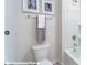 Clean bathroom features a shower/tub and white toilet, complemented by modern towel rack and artwork at 200 Parker Claire Ln, Kings Mountain, NC 28086