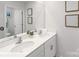 Bathroom featuring a double vanity with a sink, framed mirror, white cabinets, and modern fixtures at 200 Parker Claire Ln, Kings Mountain, NC 28086