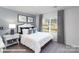 Bedroom features carpet, white walls, stylish headboard, and natural light from the window at 200 Parker Claire Ln, Kings Mountain, NC 28086