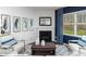 Bright living room with fireplace, blue accent wall, and neutral decor at 200 Parker Claire Ln, Kings Mountain, NC 28086