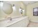 Bright bathroom features double sinks, decorative mirrors, and ample counter space at 2010 Creekwood Dr, York, SC 29745