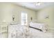 Bright bedroom features twin beds and windows, creating a cozy and inviting space at 2010 Creekwood Dr, York, SC 29745