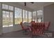 Relaxing sunroom features a table and chairs with views of the backyard at 2010 Creekwood Dr, York, SC 29745