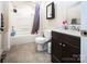 Cozy bathroom with a shower and tub combination, modern sink, fixtures and tiled floor at 209 W Church St, China Grove, NC 28023