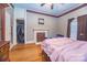 Bedroom with closet, hardwood floors, and neutral-colored walls at 209 W Church St, China Grove, NC 28023