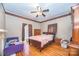 Cozy bedroom with hardwood floors, ceiling fan, and neutral-colored walls at 209 W Church St, China Grove, NC 28023