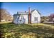 Exterior view of a fenced home with a grassy lawn and blue house siding at 209 W Church St, China Grove, NC 28023