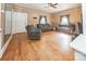 Spacious living room with hardwood floors, neutral walls, and multiple seating areas at 209 W Church St, China Grove, NC 28023