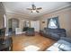 Open living room featuring hardwood floors, neutral paint, and a cozy seating arrangement at 209 W Church St, China Grove, NC 28023