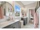 This bathroom features double sinks, lots of light, and great fixtures and finishes at 2150 Paddlers Cove Dr, Clover, SC 29710