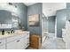 A modern bathroom with double vanities, sleek mirrors, and glass shower enclosure at 2150 Paddlers Cove Dr, Clover, SC 29710