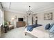 Relaxing bedroom features a tray ceiling, wood dresser and a window with natural light at 2150 Paddlers Cove Dr, Clover, SC 29710