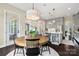 Dining area featuring a round table with black chairs adjacent to kitchen at 2150 Paddlers Cove Dr, Clover, SC 29710